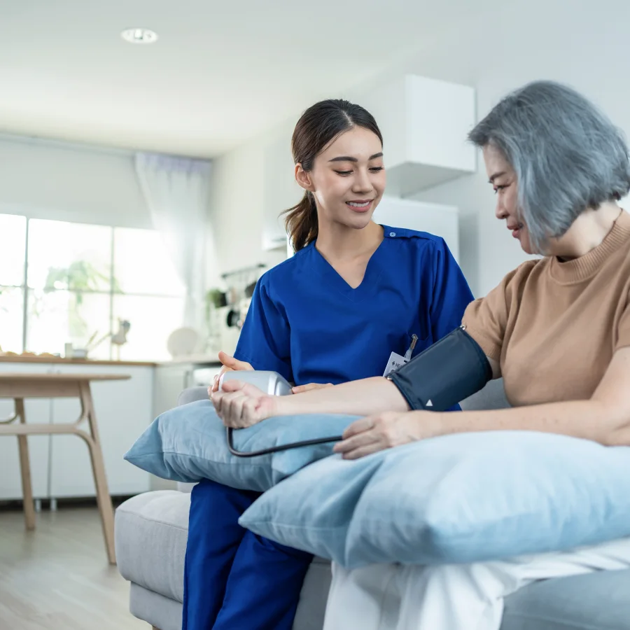 An OnSite Nurses nurse taking a participant's blood pressure at home
